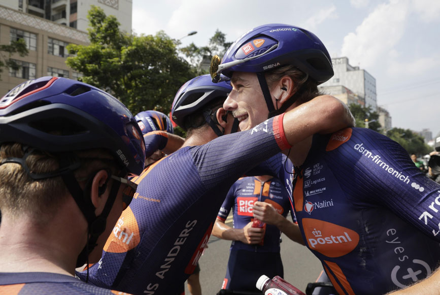 Team Picnic PostNL hugging Frits after Stage 2 win at the 2026 Tour of Guangxi.	